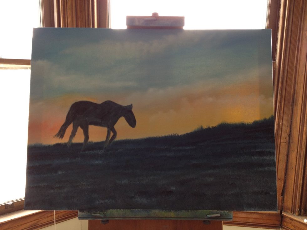 Add ivory black to a small craft brush and darken in your horse silhouette. Use flexible putty knife to add shadows to the silhouette opposite the sunset.