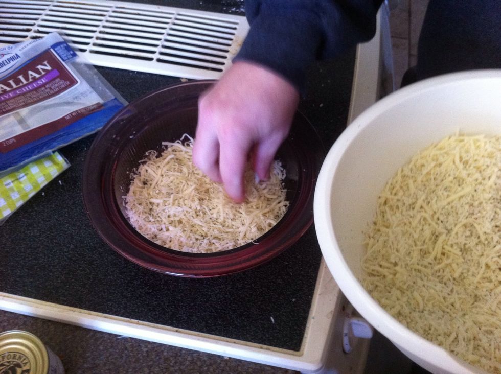 Add just a little bit of the cheese mixture to the bottom of the dish (about a 1/4 of a layer)