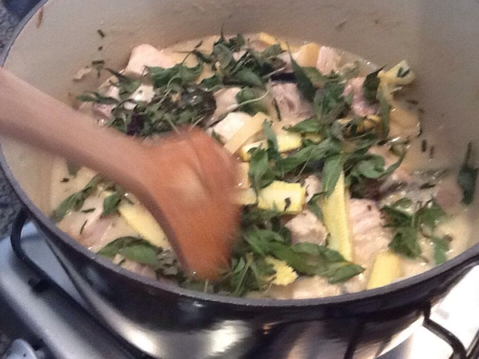 Add kaffir lime leaves, simmer for 5-10 minutes until fish is just cooked. Add basil leaves