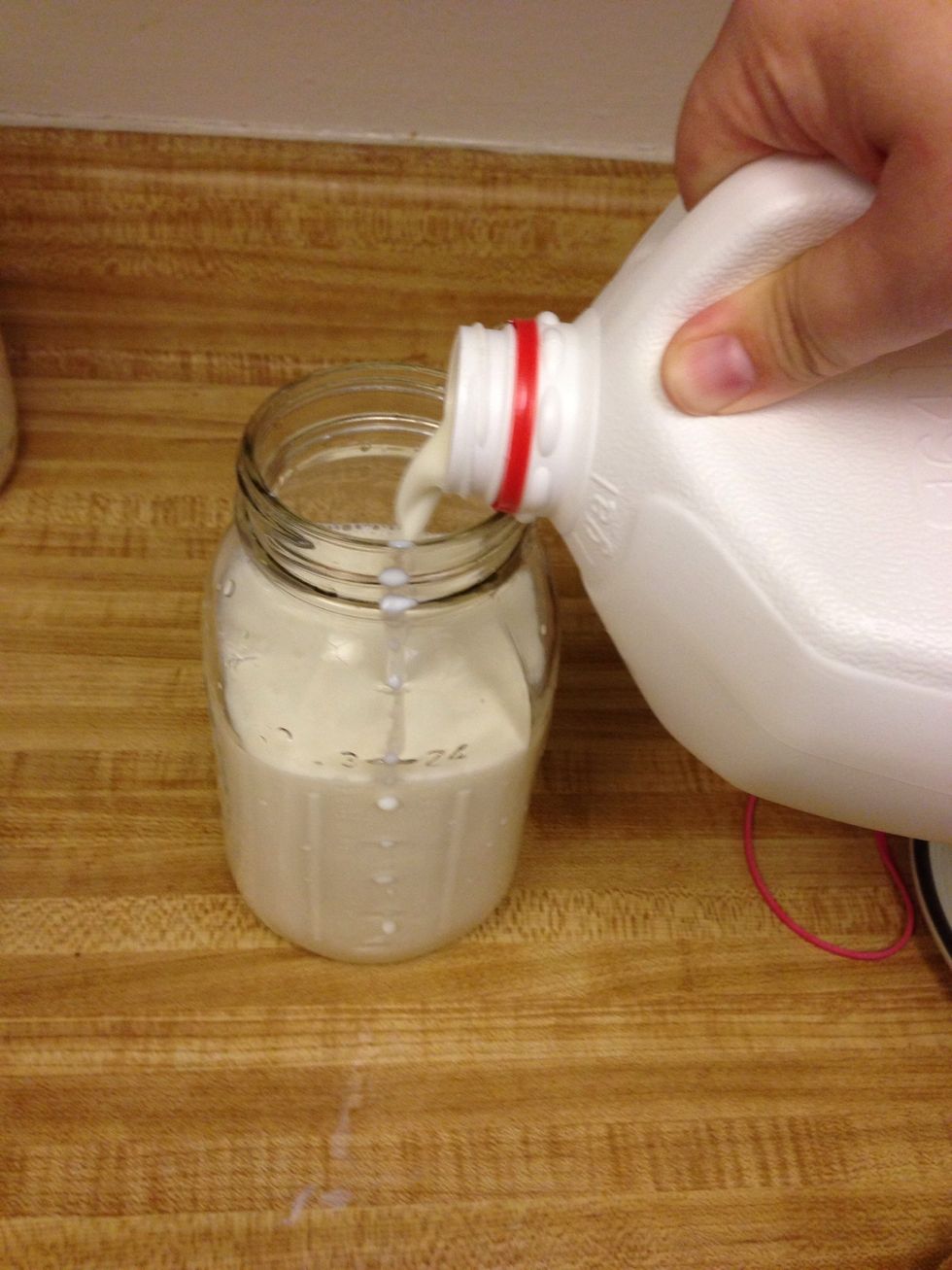 Add kefir to a pint jar and pour milk over until it reaches the bottom lip.
