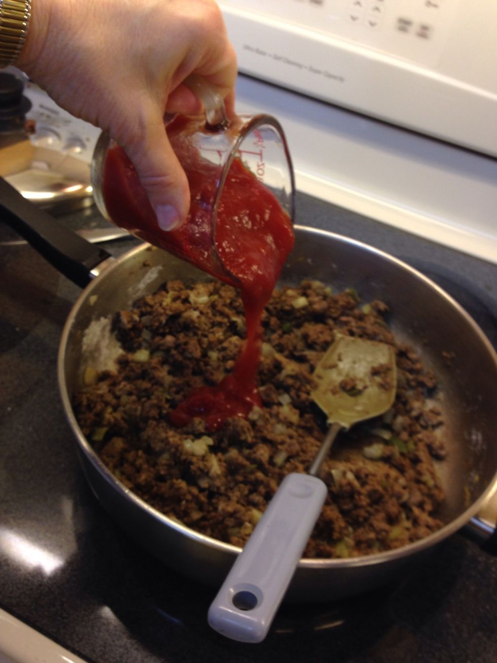 Add ketchup, worcestershire sauce and sugar.