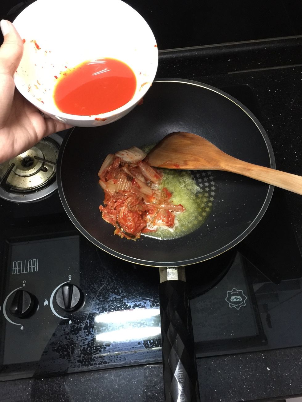 Add kimchi (without the kimchi juice, but keep it for later use).