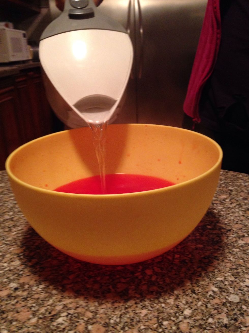 Add kool aid and boiled water into the bowl