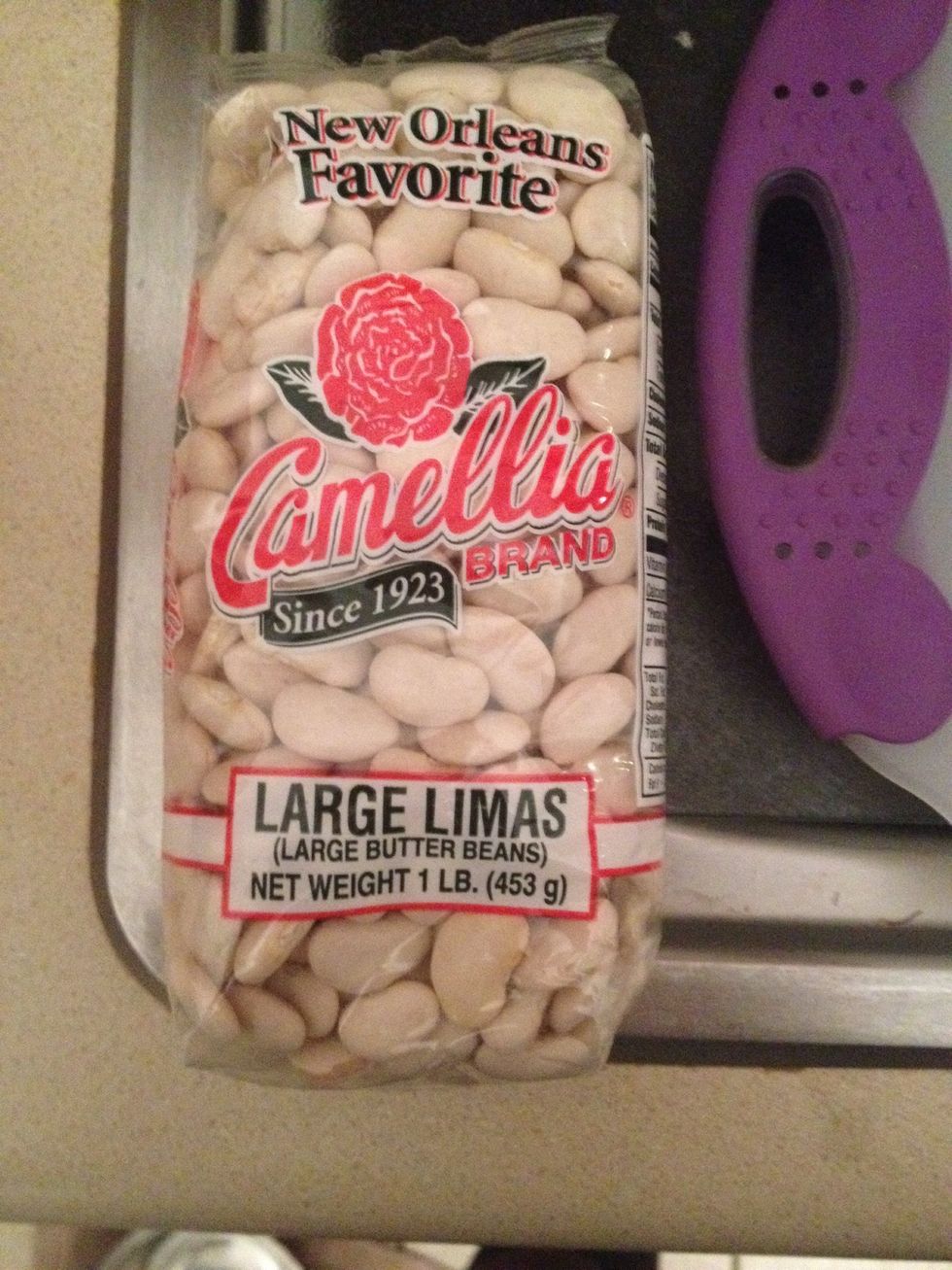 Add large dried Lima beans to pot with 6 cups of water and 1/4 cup of season all.  Let sit for at least 5 hours.  I usually let it sit over night and turn the crock pot on I. The morning