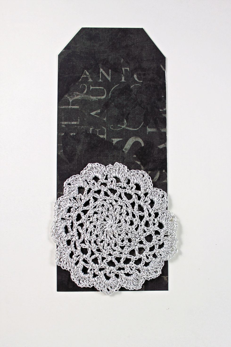 Add large Prima crochet lace doily to the lower half of the tag.