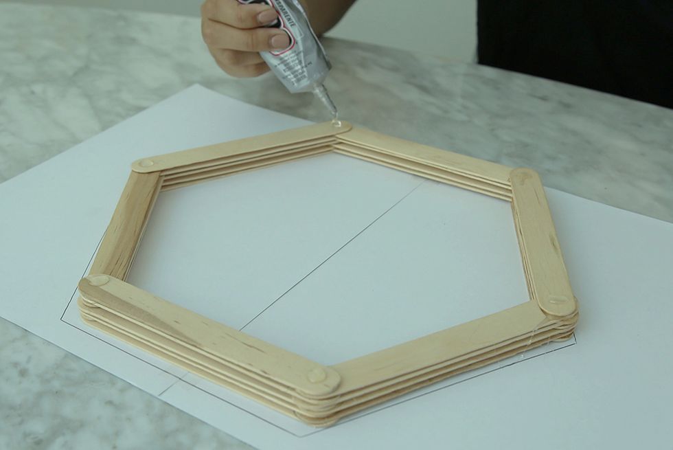 Add layer after layer until you get the desired height. We stopped at 10, but you don't have to! The deeper the frame, the more dramatic the mirror will be on your wall.