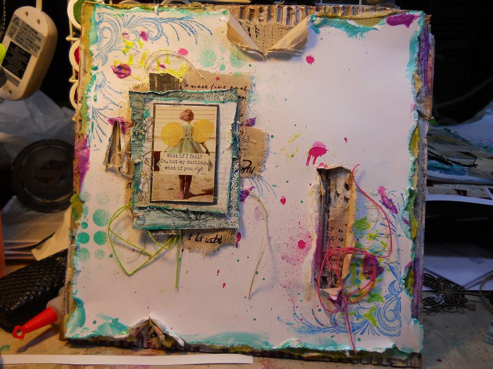 add layers of distressed patterned paper, and a photo.
