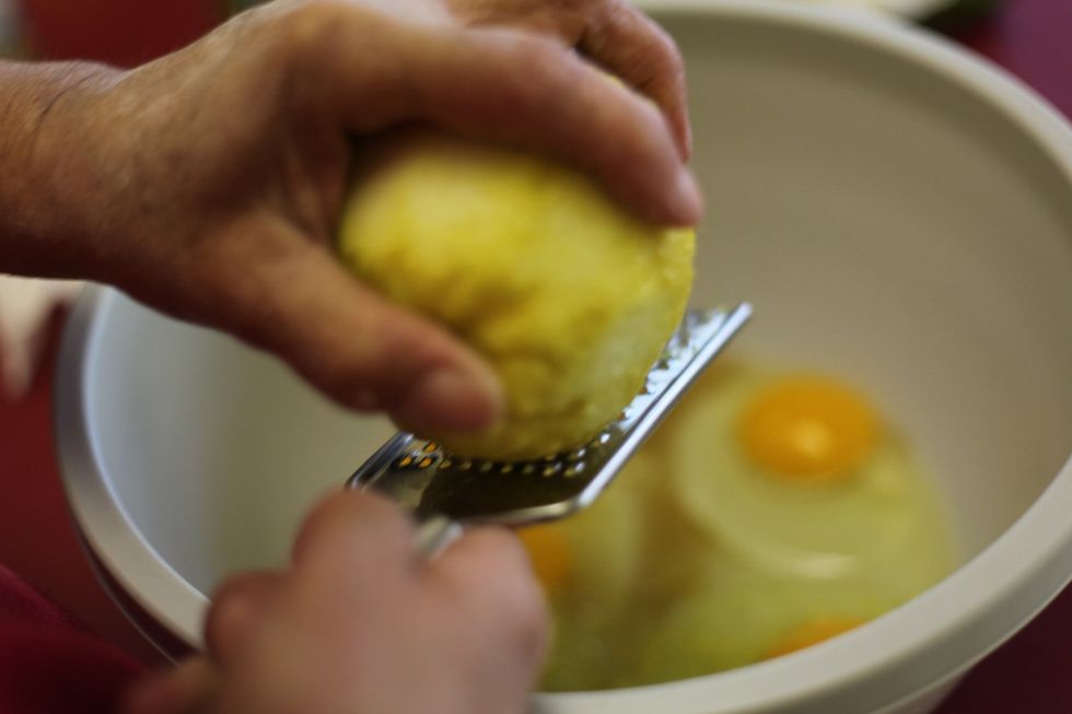 Add lemon rind to the eggs and vanilla. This is purely for the smell. This is optional.