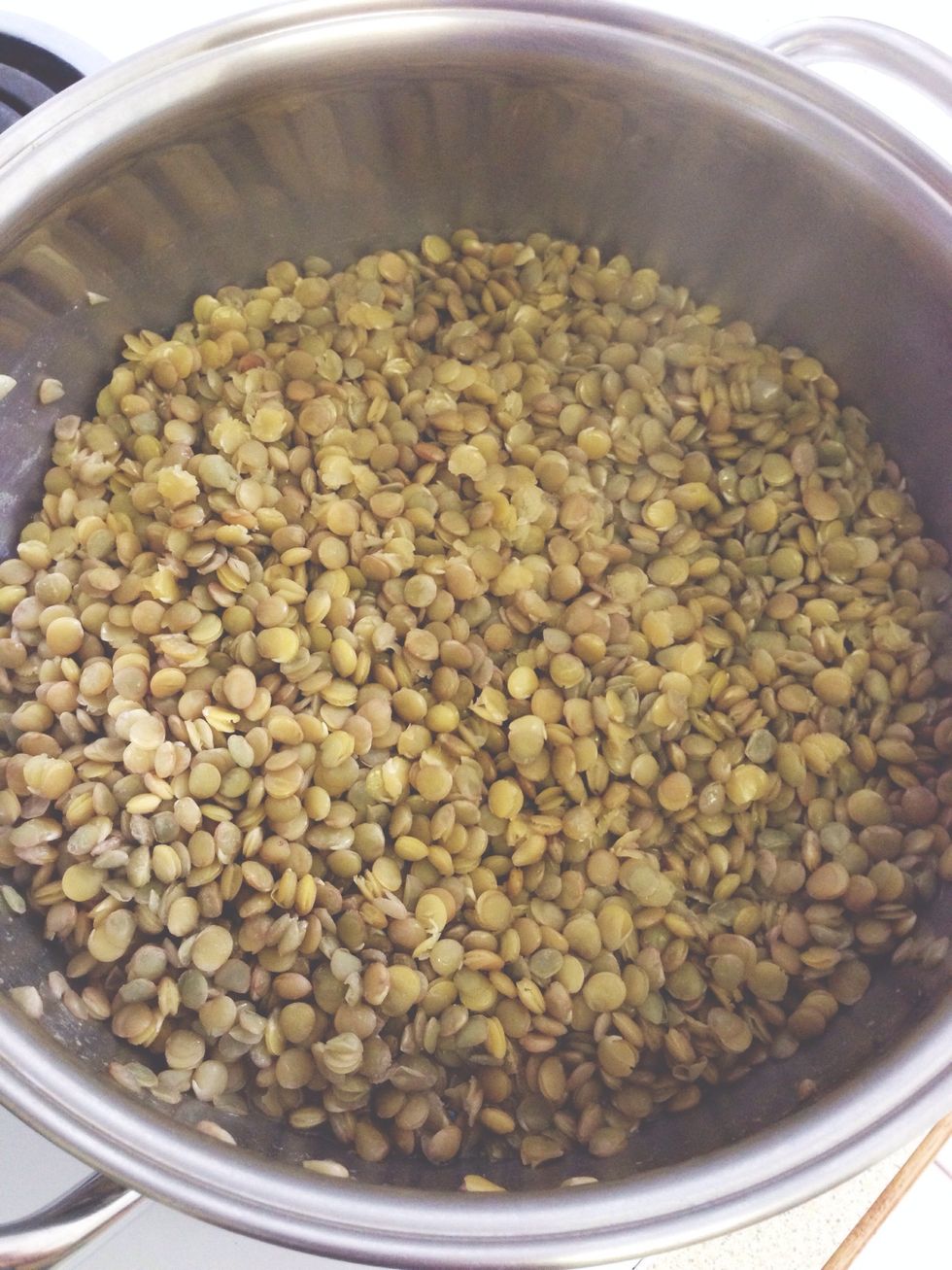 Add lentils to a pot with 1.5 cups of vegetable broth. Bring to a boil, then lower to a simmer for approximately 15 min, or until lentils are tender, NOT mushy.