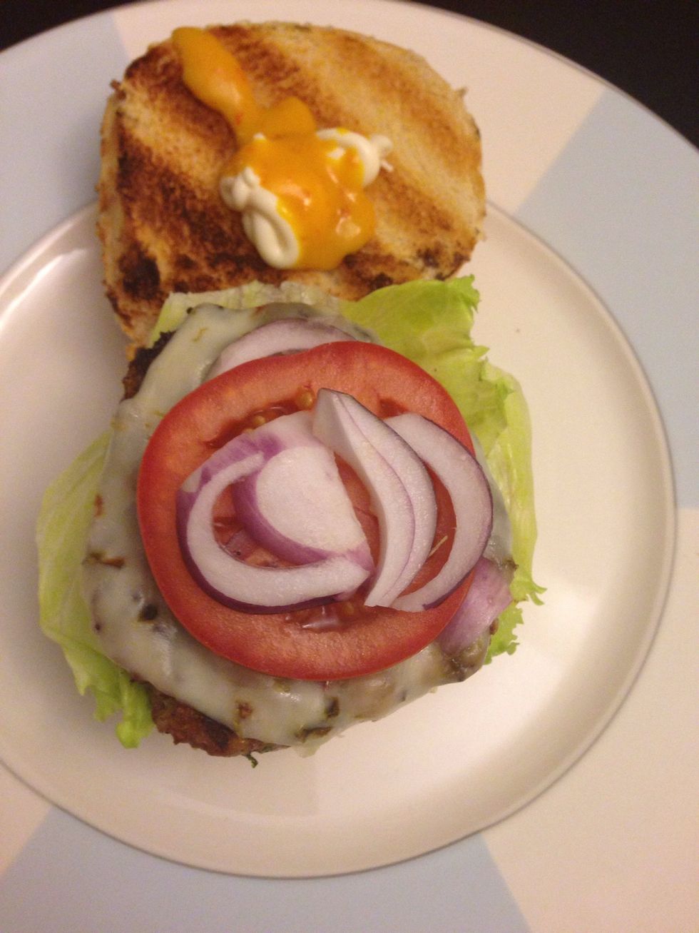 Add lettuce, tomato and onion. On the top bun put mayo along with your fav. Hot sauce