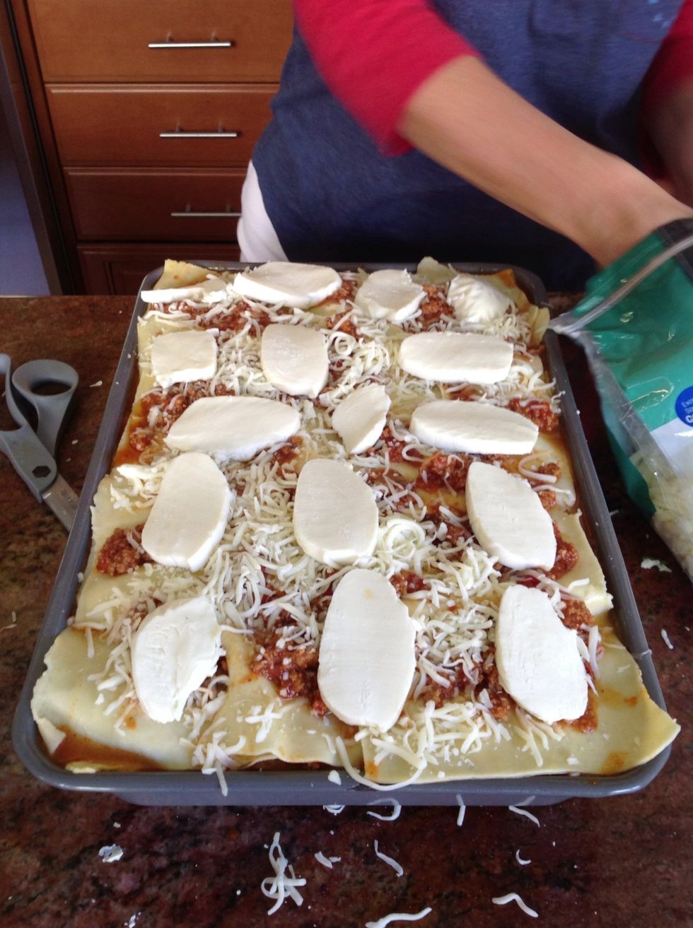 Add Light pasta sauce, mozzarella, Parmesan and fresh mozzarella to top it off!!!