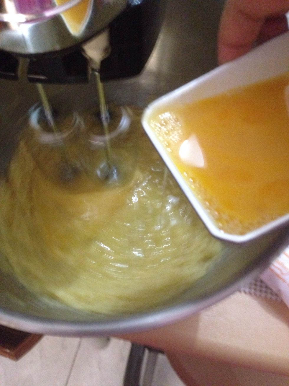 Add lightly-beaten egg and continue to beat until it becomes smooth thick dough