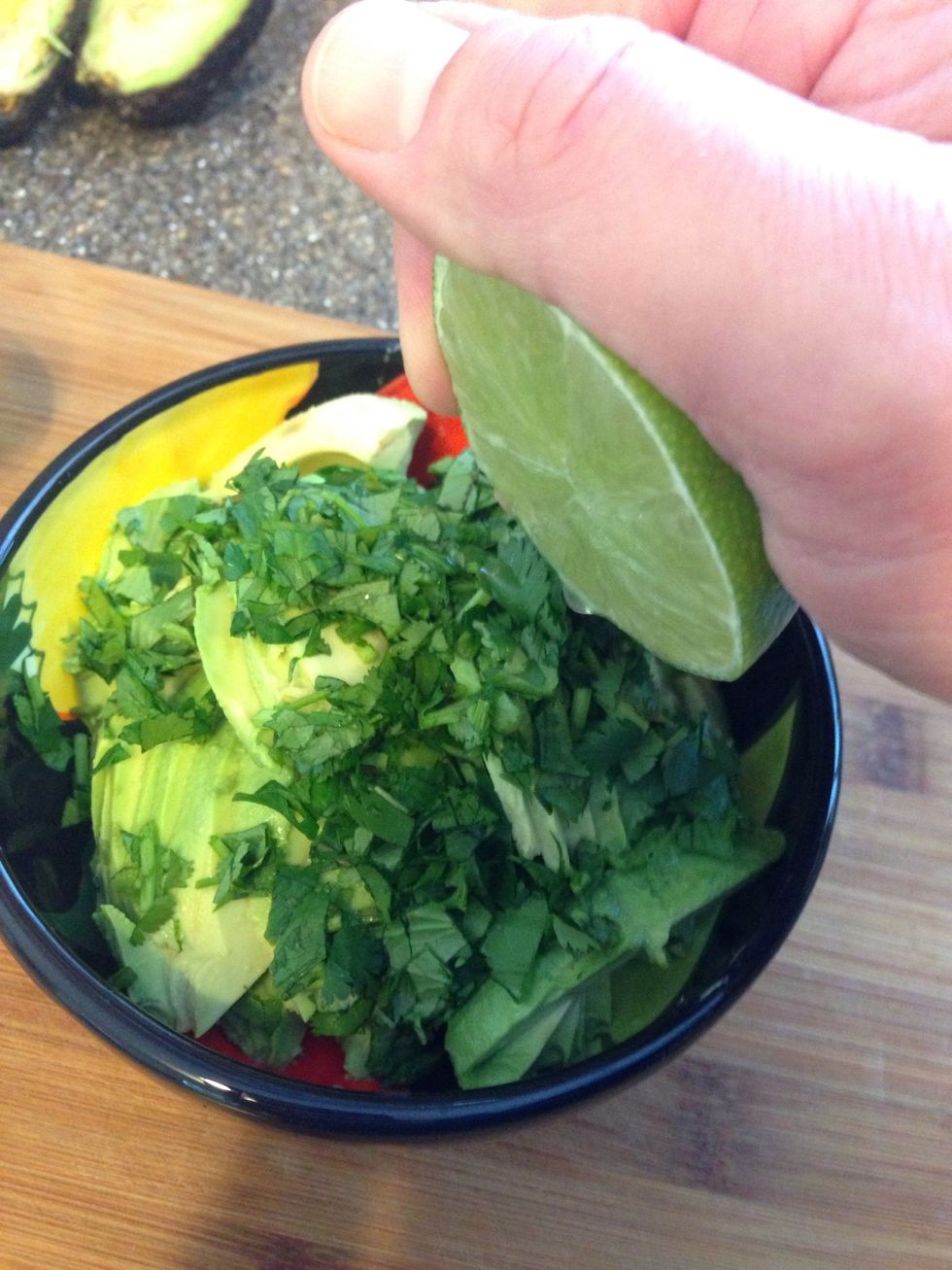Add lime juice & stir. I do break up the avocado slices a bit by leave them intact (again, not a mushy guac fan).