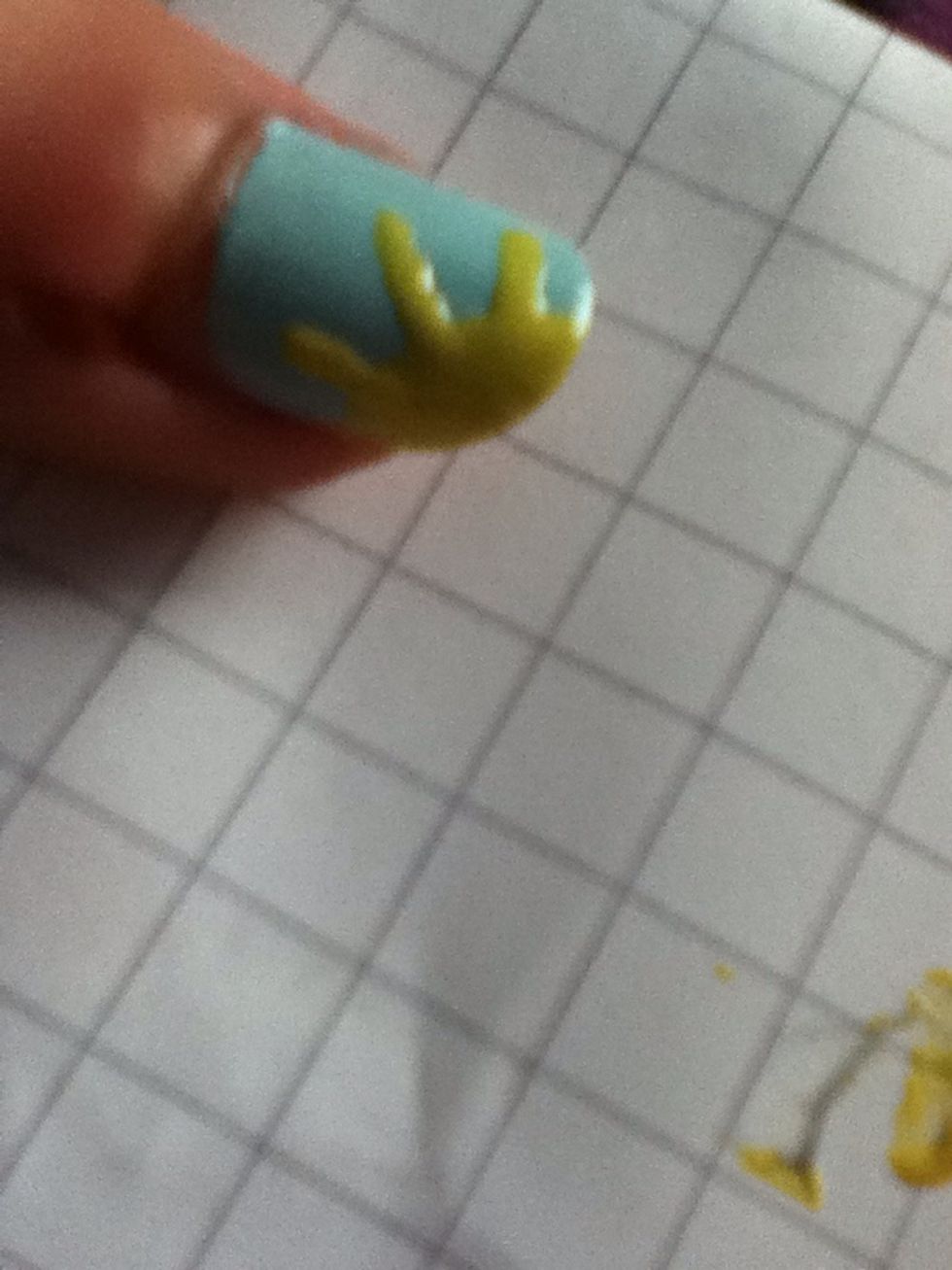 Add lines to create sunbeams, and your first nail is done.