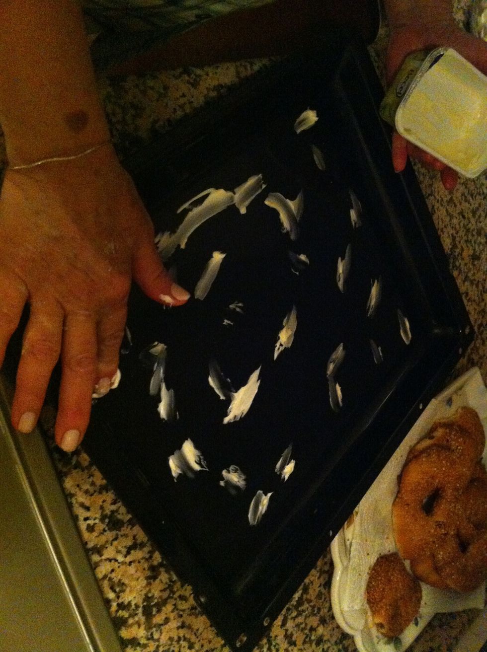 Add little butter to oven Tray .