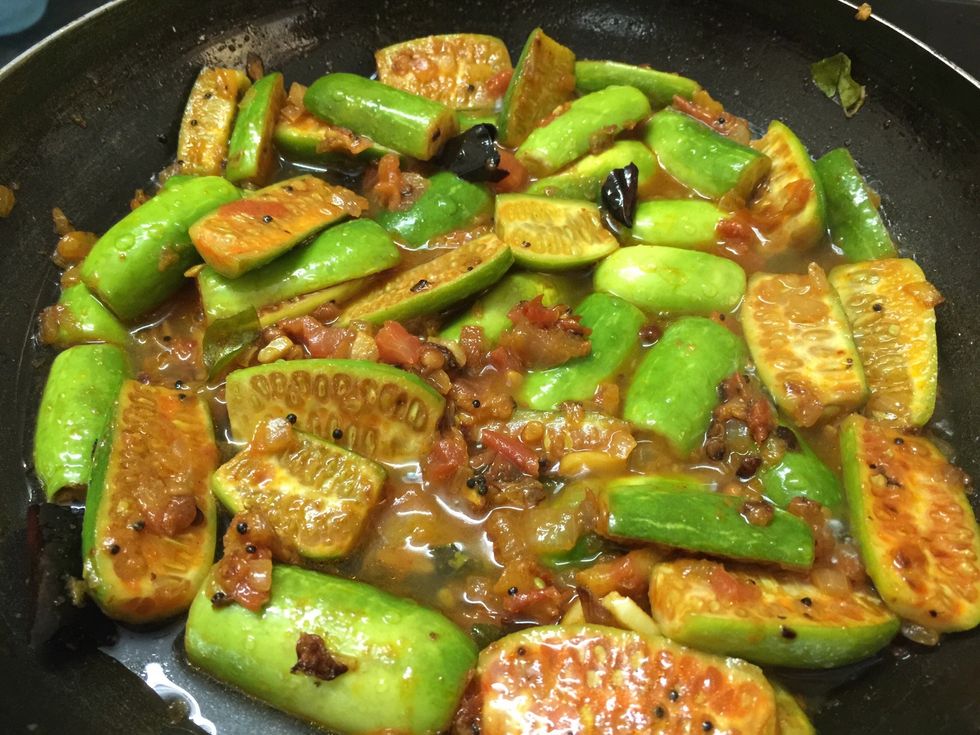 Add little water to cook kovakai (Ivy Gourd)