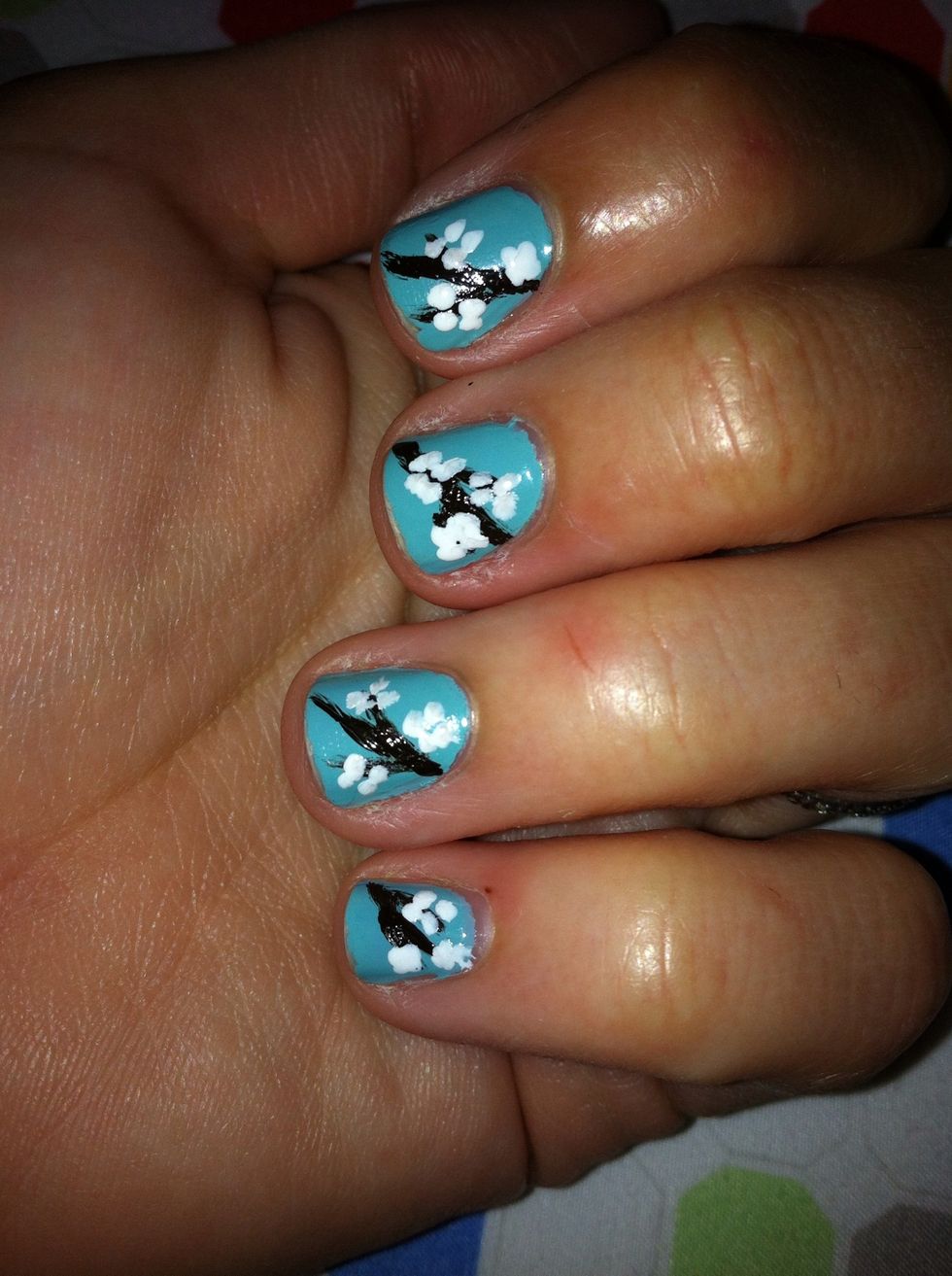 Add little white dots to make the flower petals