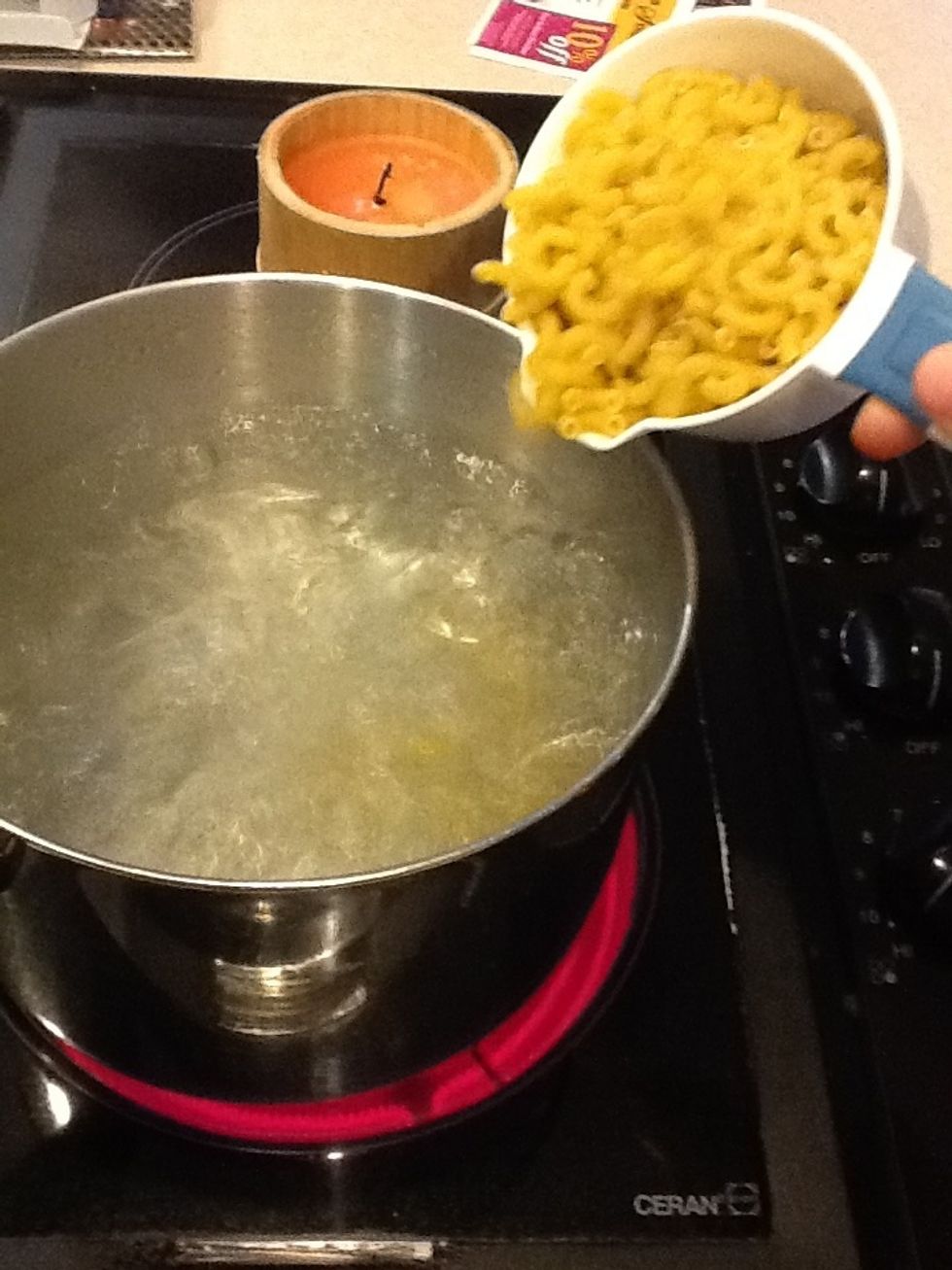 Add macaroni noddles to boiling water. Stir occasionally.