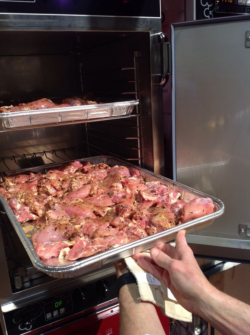 Add marinated chickens to smoker.