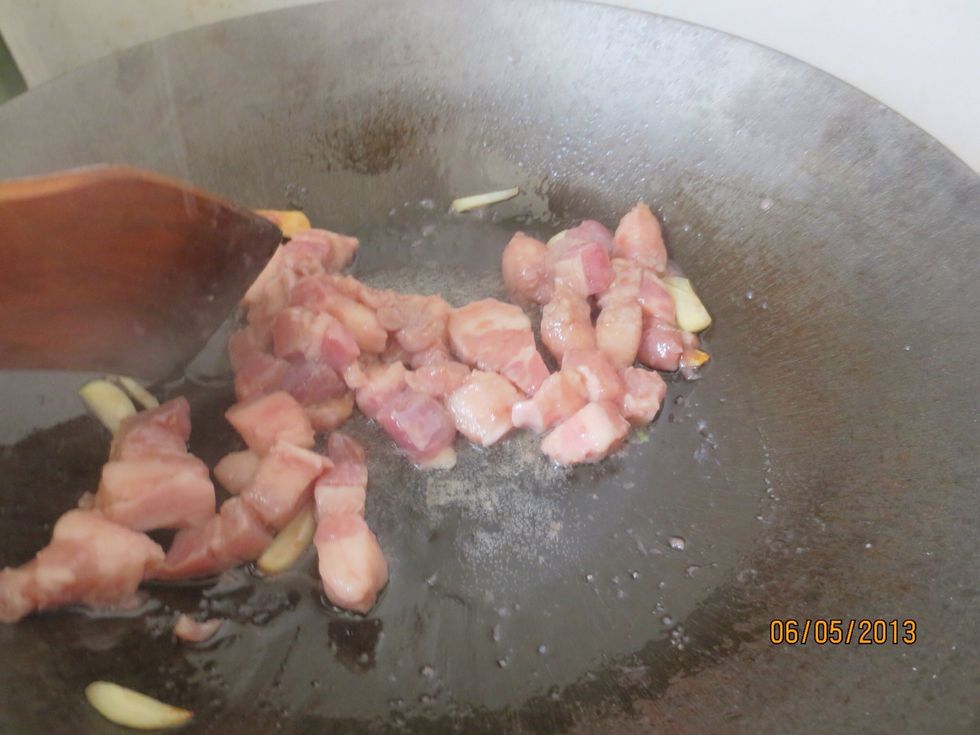 Add marinated pork and stir fry until almost cooked on medium heat