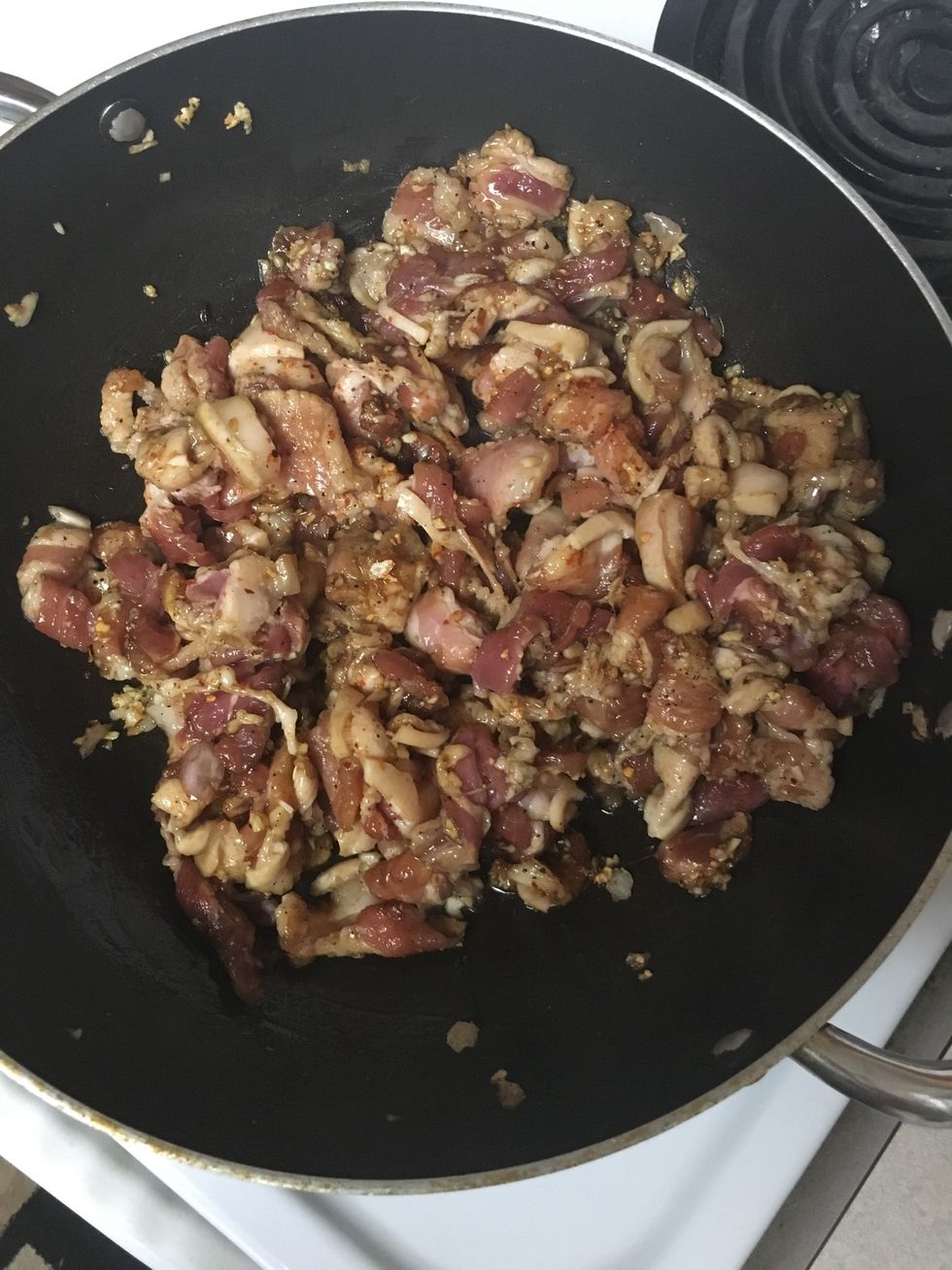 Add marinated pork belly, cook slightly