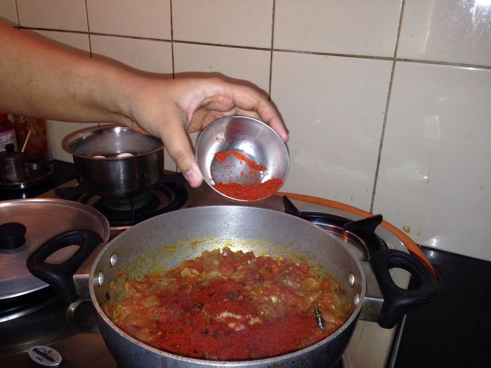 Add masala powder. This powder is a combination of Indian spices and red chilli powder.