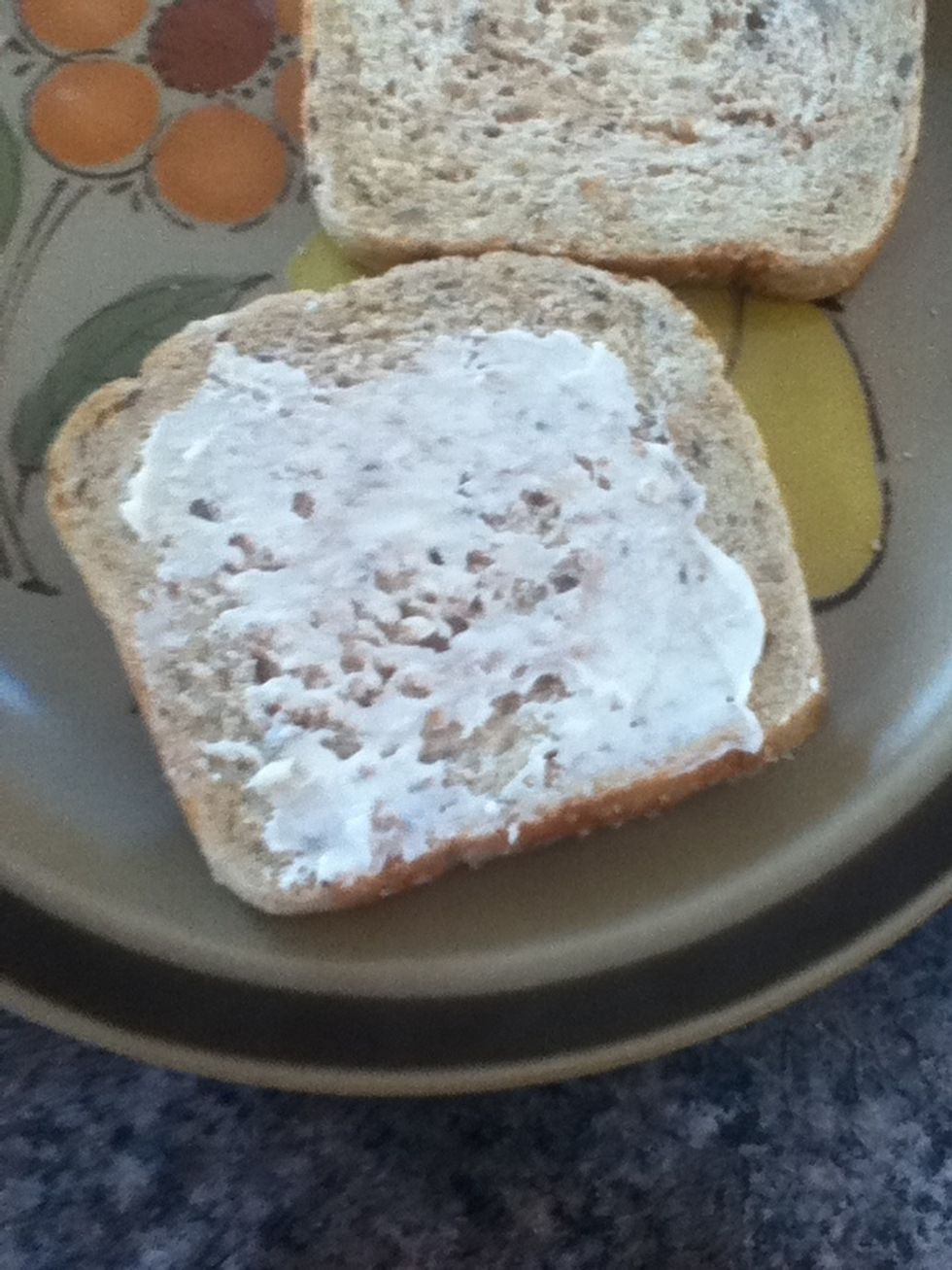 Add mayo to the first slice.