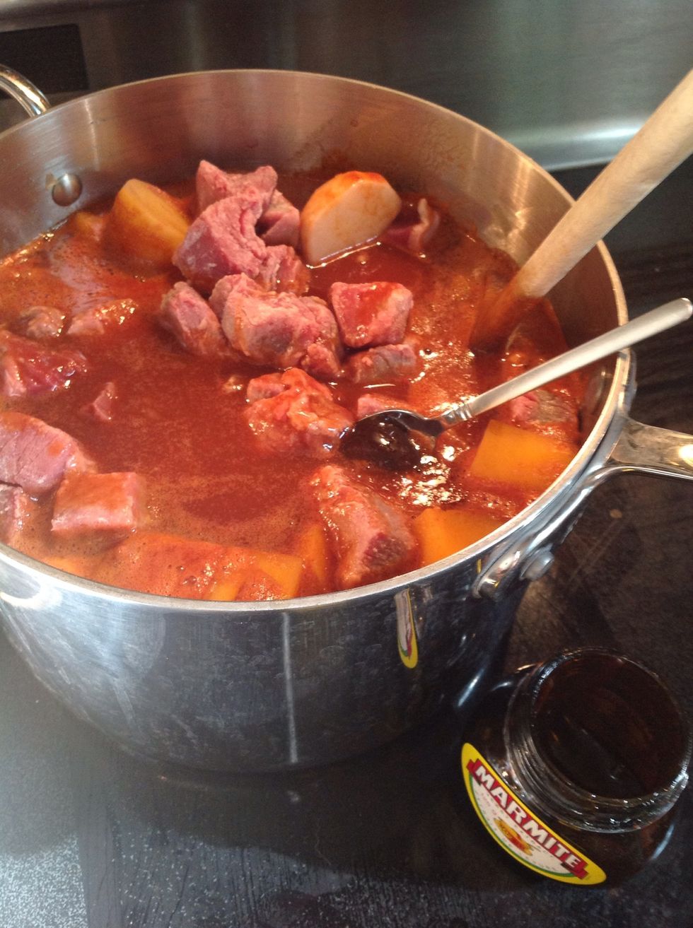 Add meat, a glass or two of red wine, and YES a spoonful of Marmite!