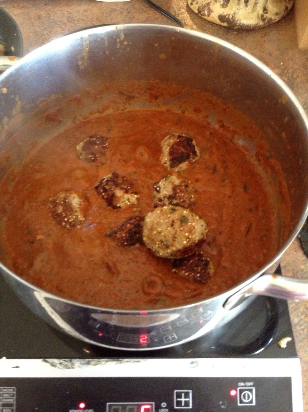 Add meat balls to sauce and simmer for 5 minutes.