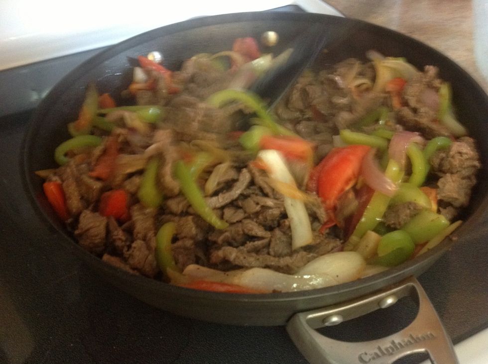 Add meat to vegetables shortly after tomatoes are put in the pan