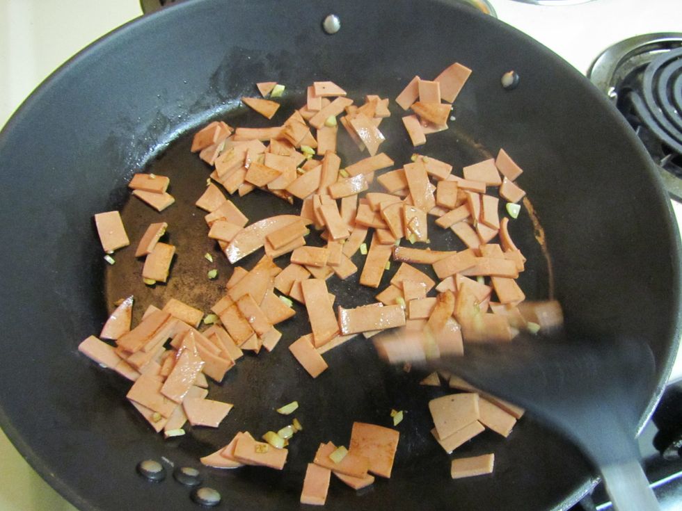 Add meat. You can use pork, chicken, spam, ham, sausage or whatever you like.