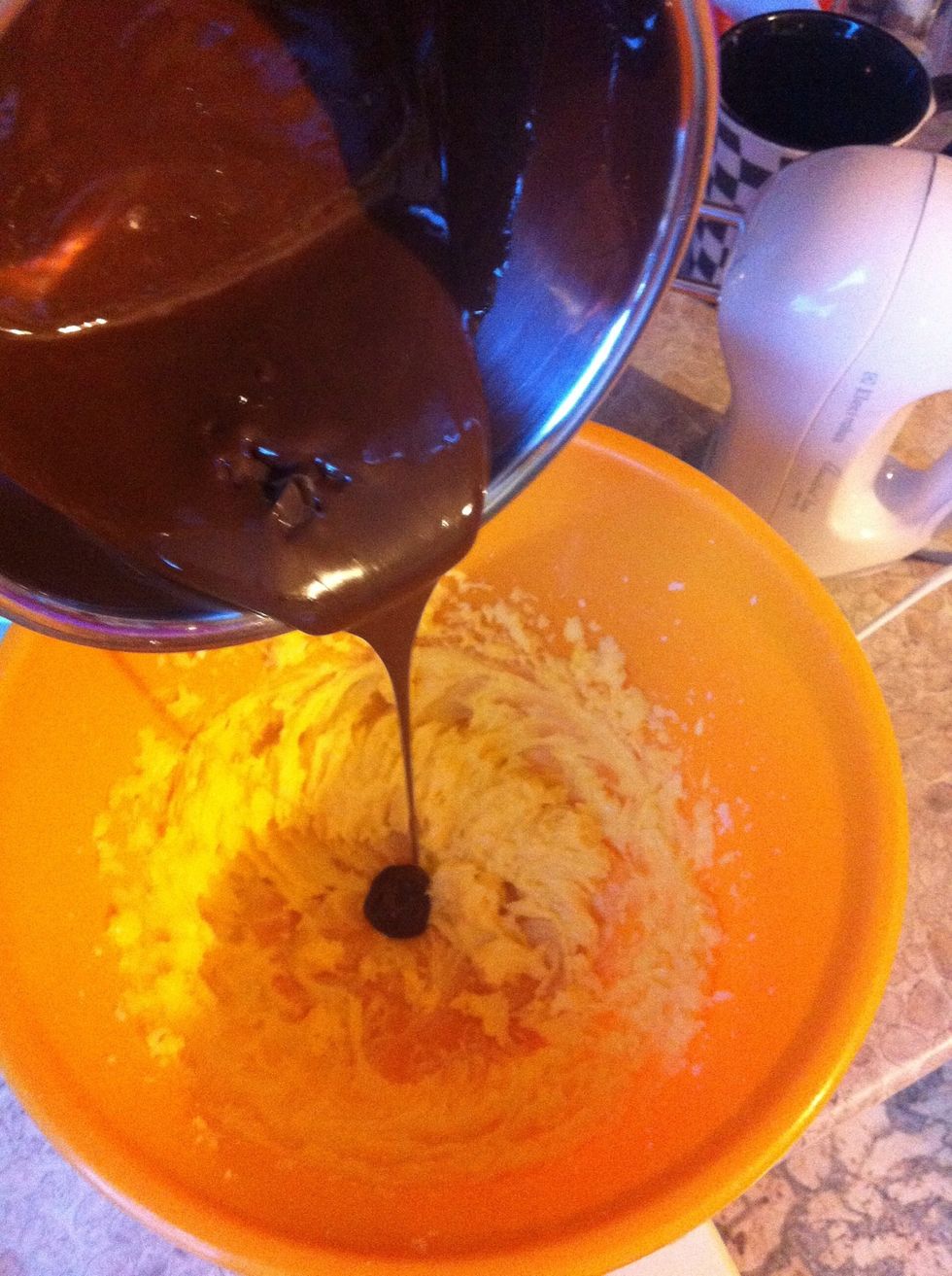 Add melted and bit cooler chocolate to the bowl with sugar-butter mixture and mix it softly.
