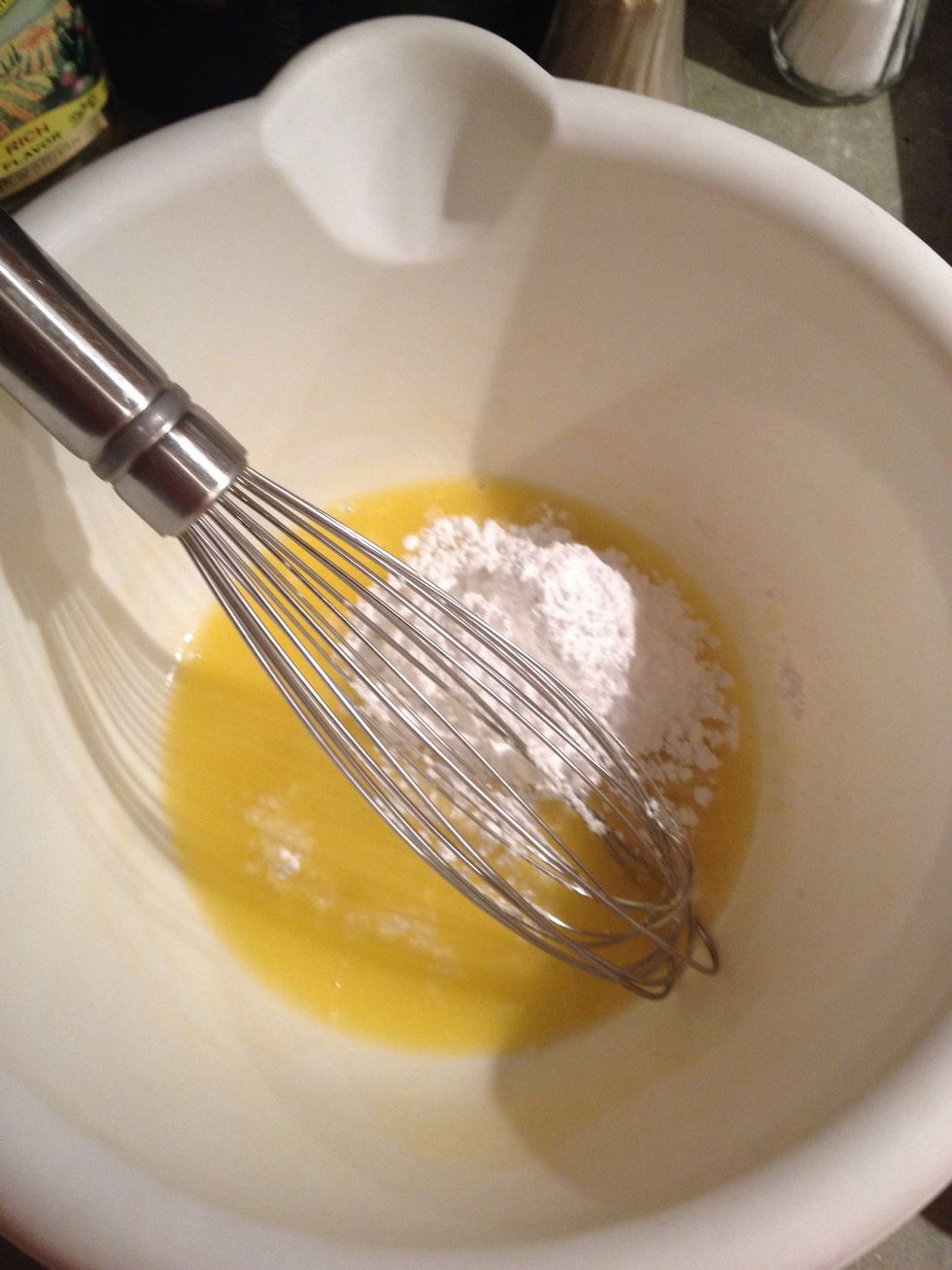 Add melted butter and powdered sugar to bowl and mix.