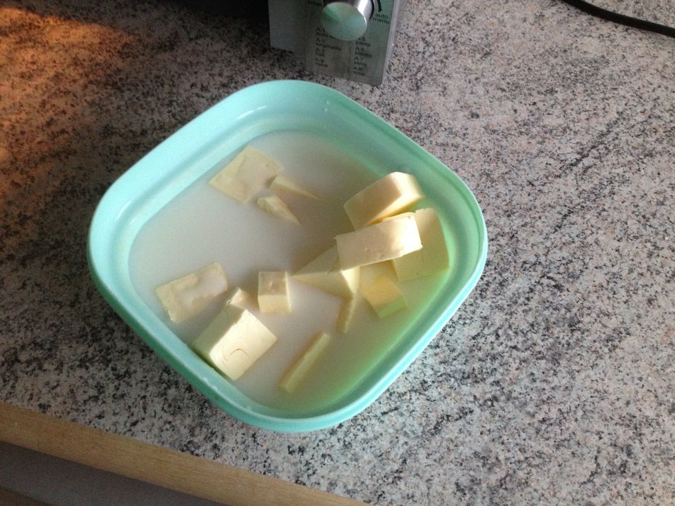 Add milk and butter to a bowl. Heat in the microwave until the milk is lukewarm, and the butter is almost melted.