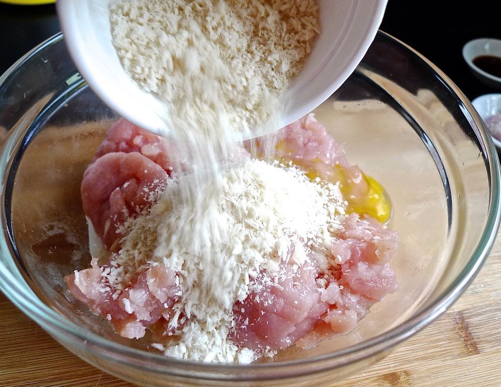 Add milk, egg and breadcrumbs into the ground chicken meat. ( These ingredients are essential to bind and hold the patty together ).