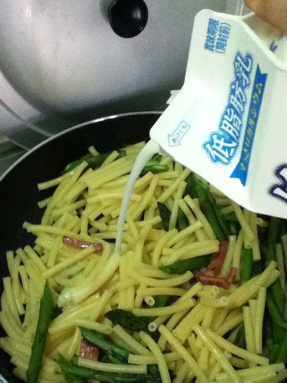 Add milk. I don't measure so I don't know how much I used but I'd say just less than it covers the pasta, I think lol