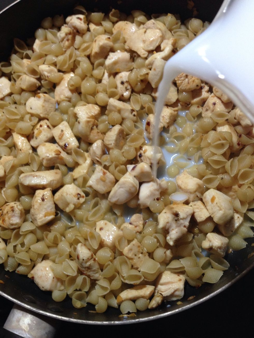 Add milk/water solution. Bring to a mild boil