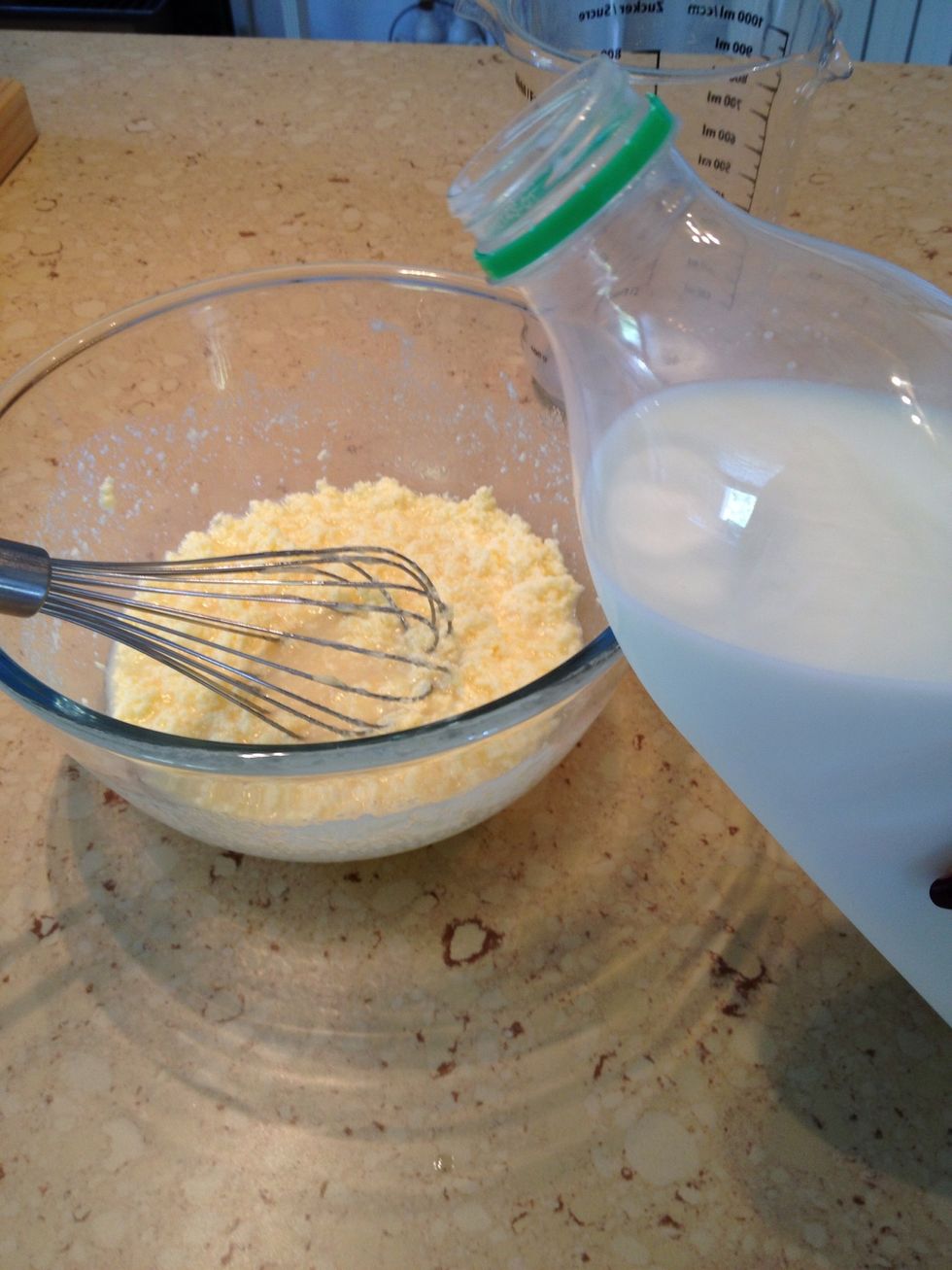 Add milk. Your dough might seem strange, weird and disgusting. Don't worry, it's normal and it will change soon!