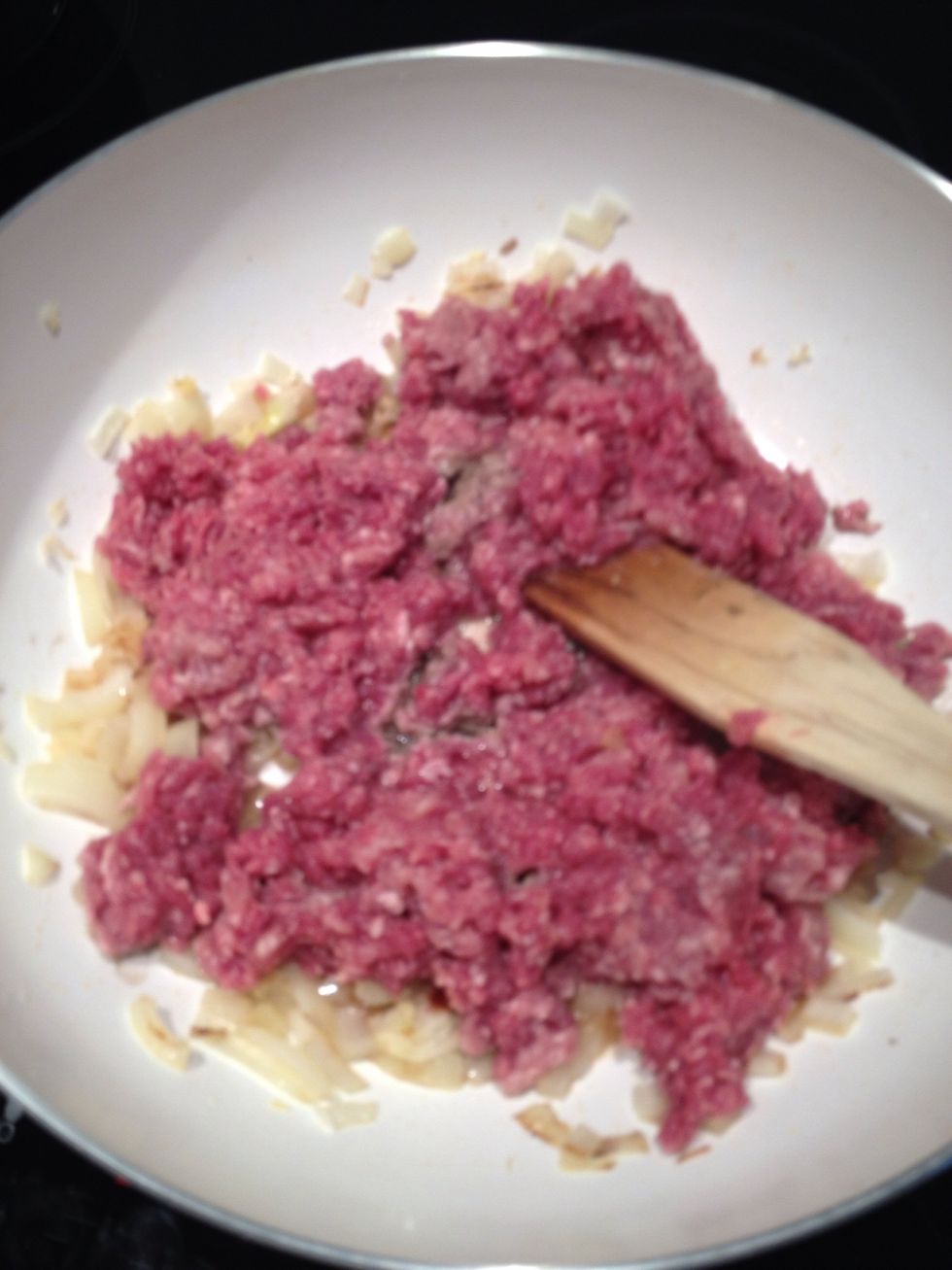 Add mince to pan and keep it moving to brown.