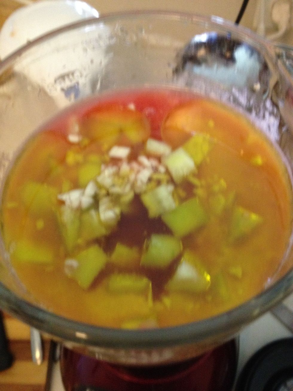 Add minced garlic clove, vinegar, and oil and blend - add salt to taste and cold water if it's too thick