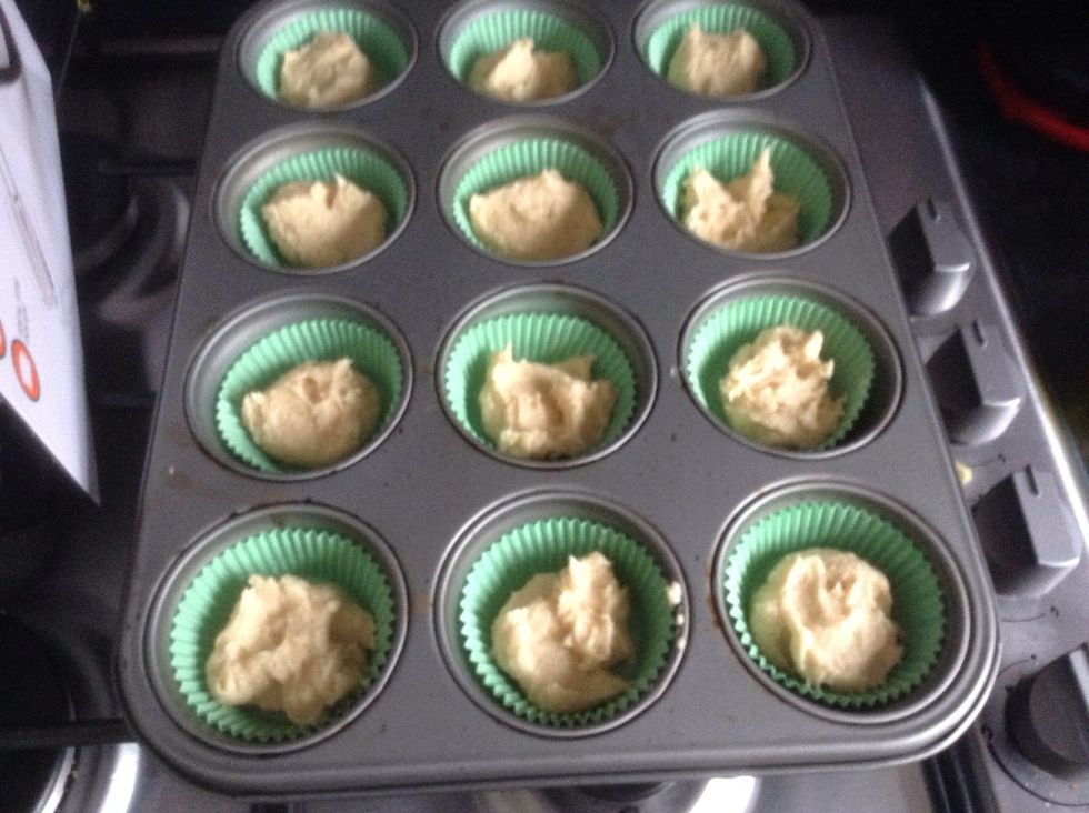 Add mixture to cake cases