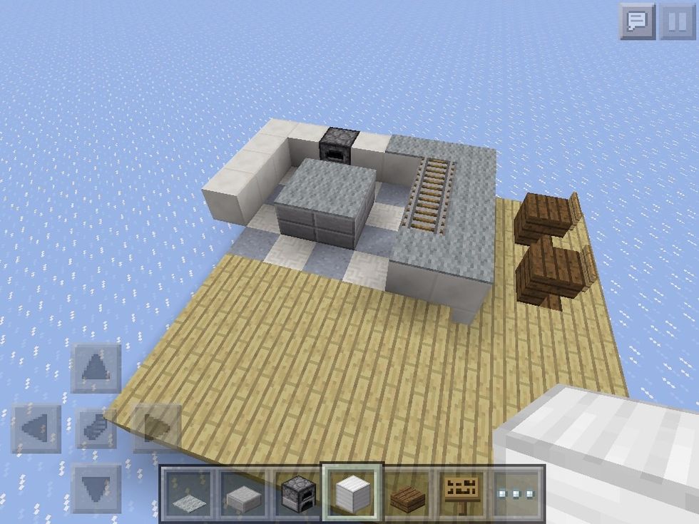 Add more counter space. Add the island. Make sure to add the furnace, too!