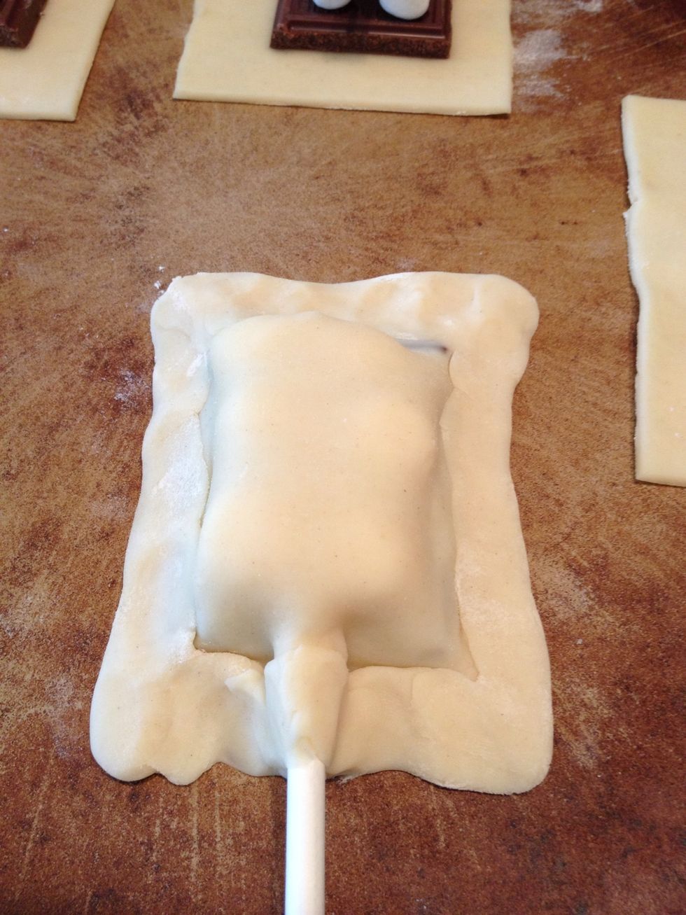Add more dough if needed, then roll sides up to make an outer edge for your s'more.