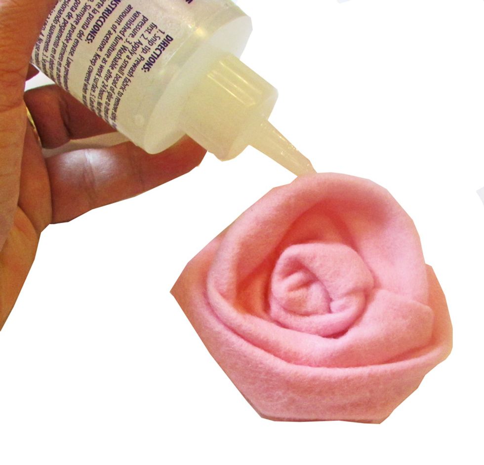 Add more glue to the top of the flower to help the "petals" stay in place.