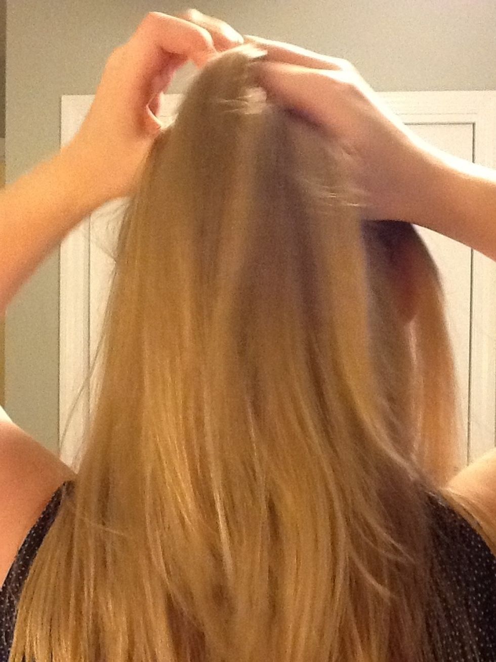 Add more hair to the left section. Cross the left section over so it becomes the middle section.