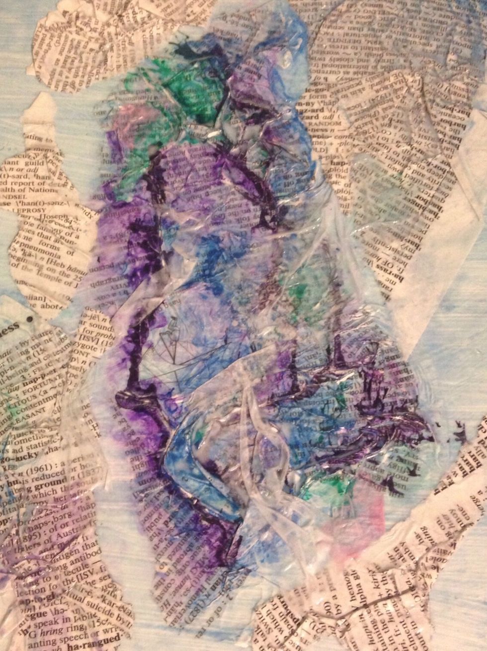 Add more layers of tissue paper and seal with modge podge to create different layers of translucency over the color. You can also add additional pieces of crumpled book pages.