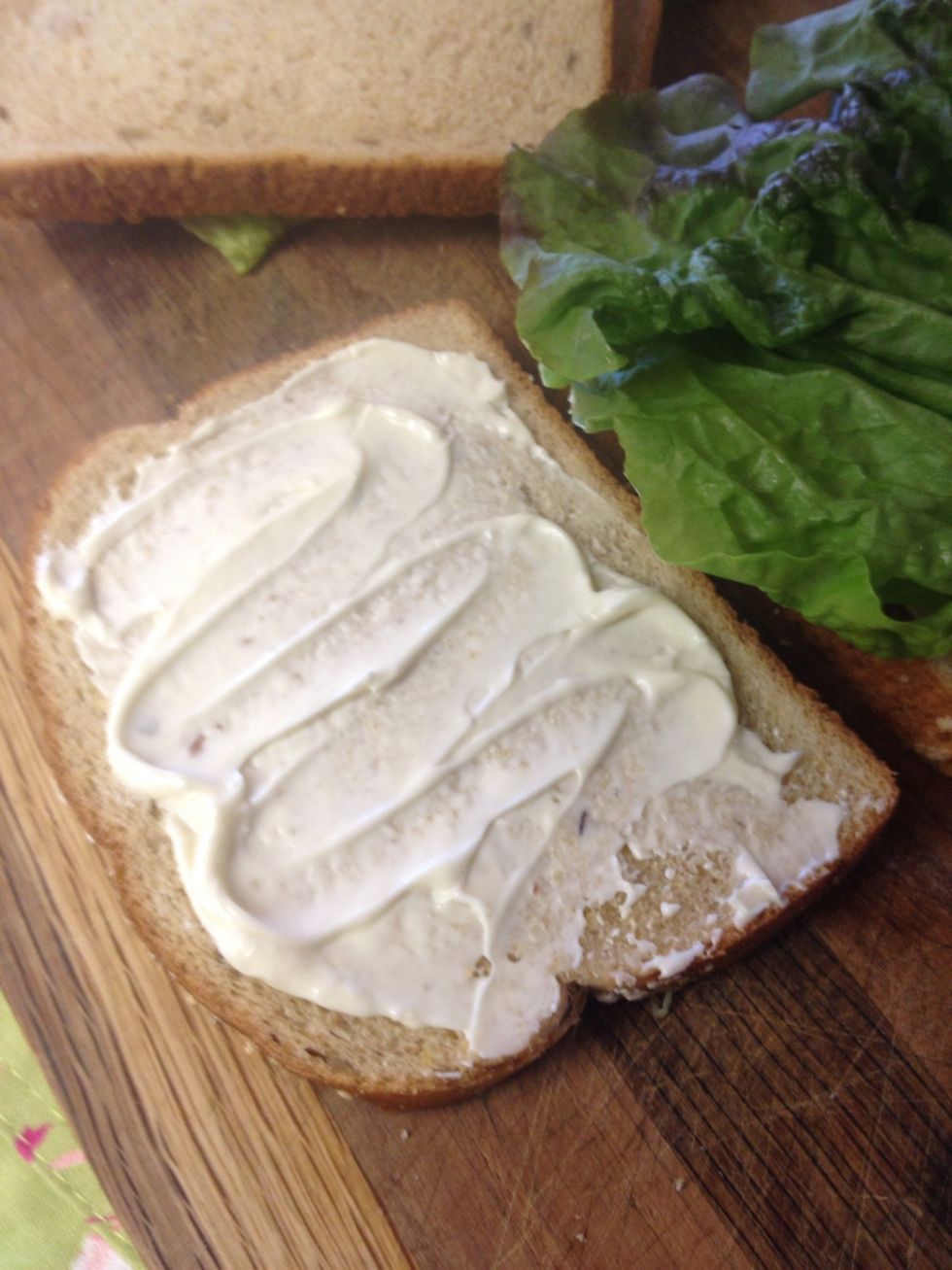 Add more mayo to the other side if you wish, then top with the red lettuce leaf.