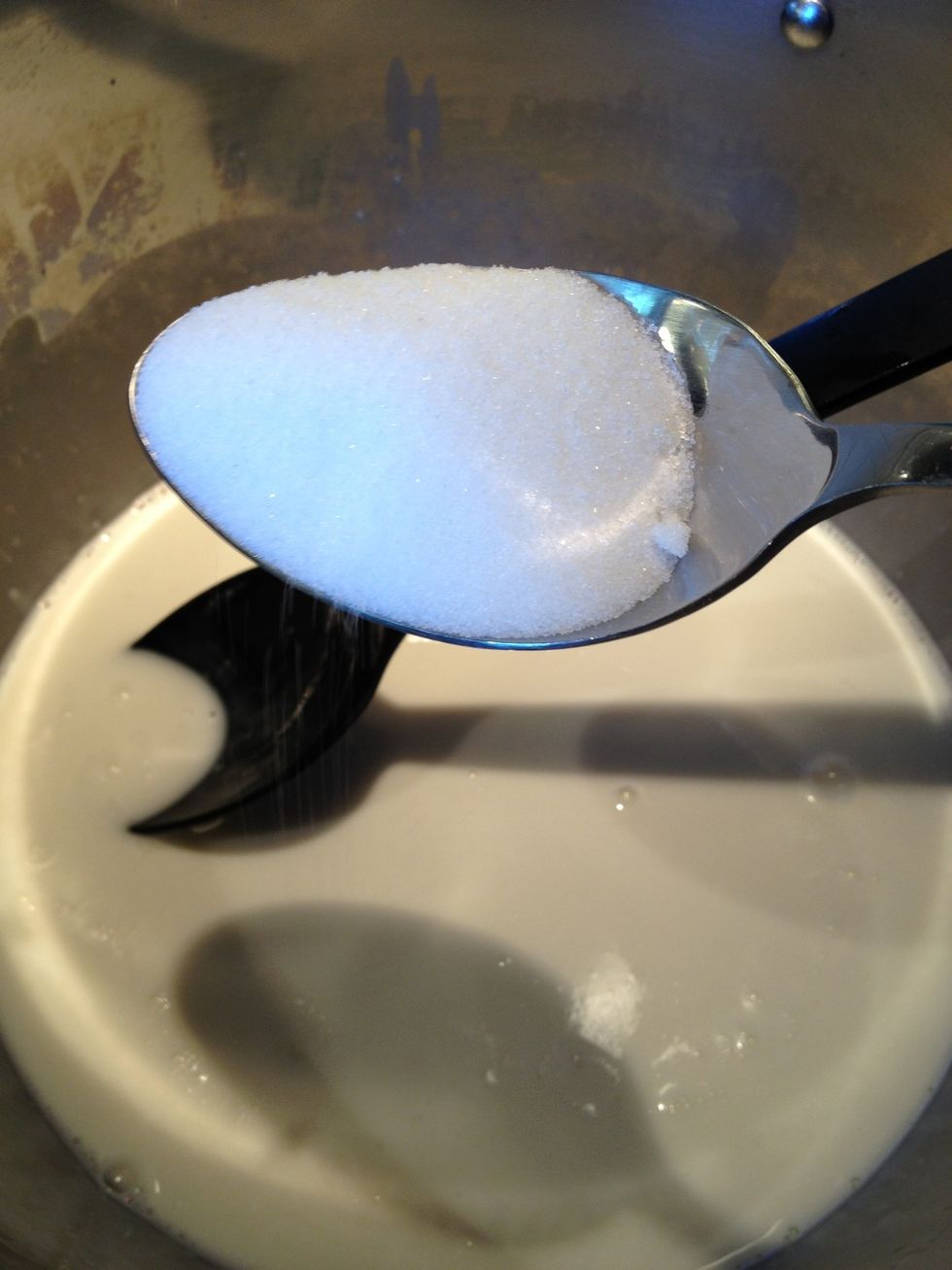 Add more milk and don't forget to add the sugar.  Keep boiling and stirring. Cook and stir, testing the rice for doneness as you go.  Keep adding milk as needed.  Be prepared to use the whole bag!