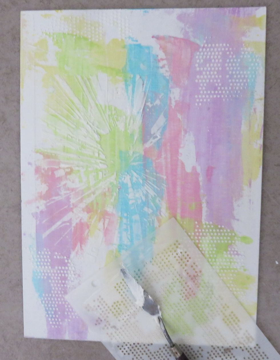 Add more texture around the canvas with Dot Matrix stencil and let it dry.