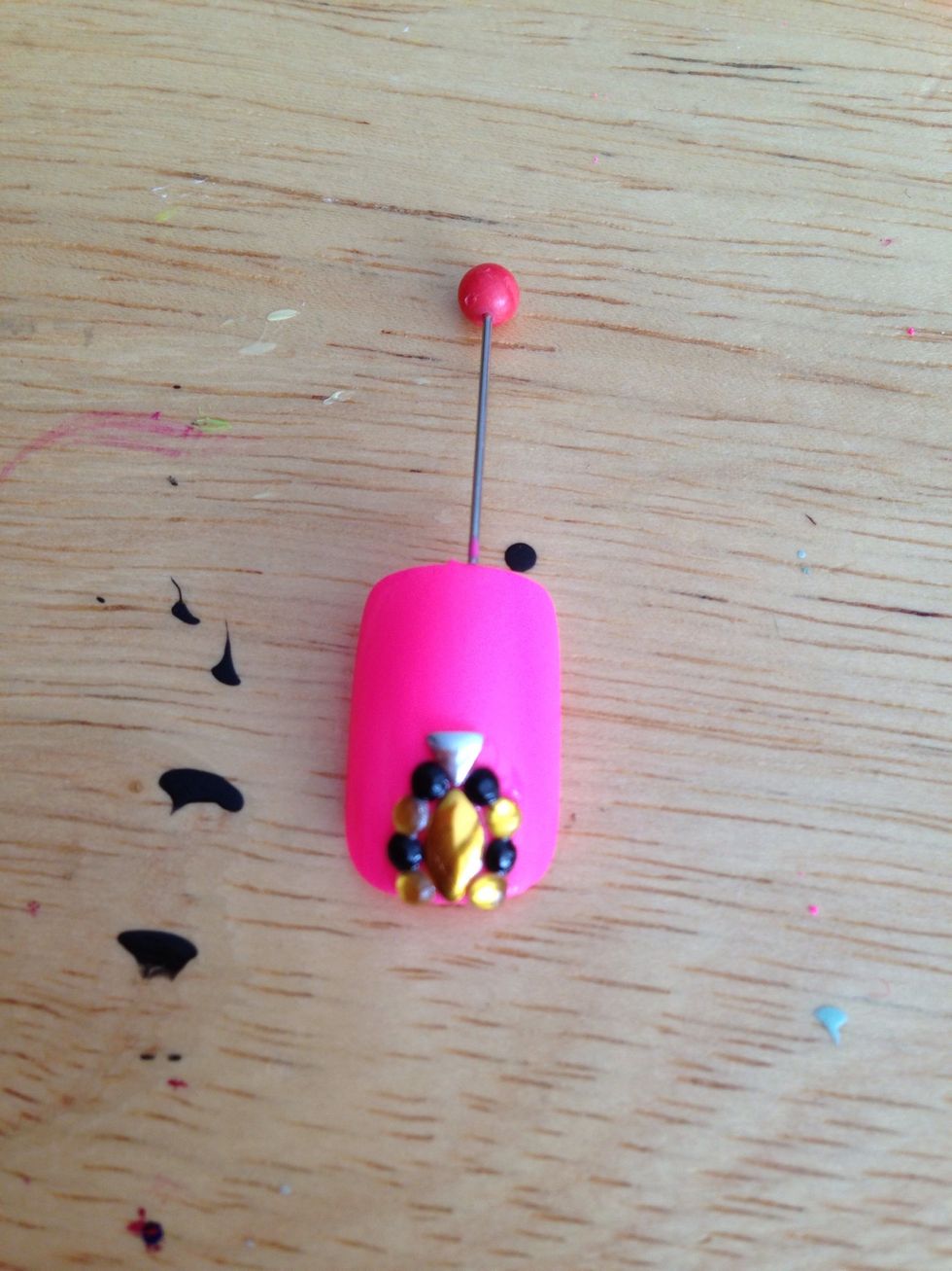 Add more Til you've found a design you like :) I decided to use black rhinestones with the pink instead of gold.